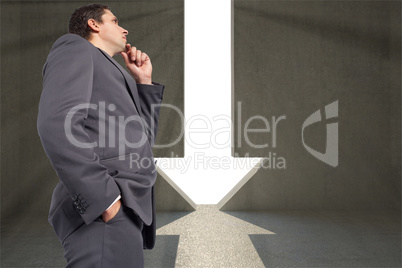 Composite image of thoughtful businessman with hand on chin