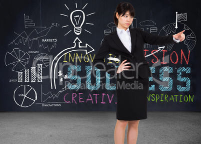 Composite image of focused businesswoman pointing