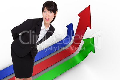 Composite image of surprised businesswoman bending