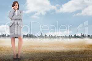 Composite image of smiling thoughtful businesswoman