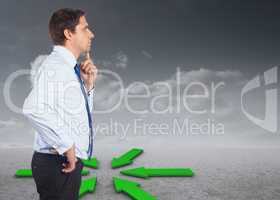 Composite image of thinking businessman touching his chin