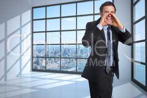 Composite image of shouting businessman