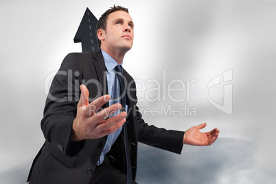 Composite image of businessman posing with arms out