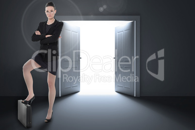 Composite image of full length of an elegant businesswoman in su