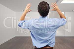 Composite image of businessman posing with arms raised