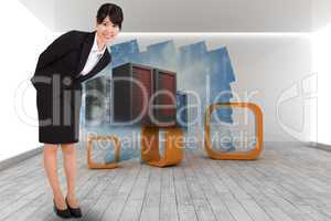 Composite image of smiling businesswoman bending