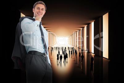 Composite image of smiling businessman holding his jacket