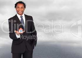 Composite image of businessman with house for real estate concep