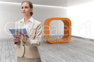 Composite image of pensive stylish businesswoman holding tablet
