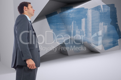 Composite image of stern businessman standing