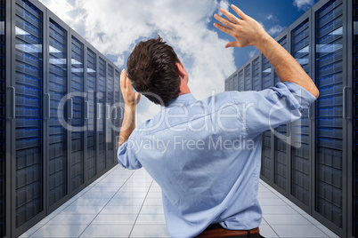 Composite image of businessman posing with arms raised