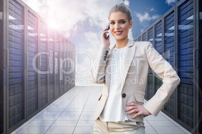 Composite image of cheerful elegant businesswoman on the phone