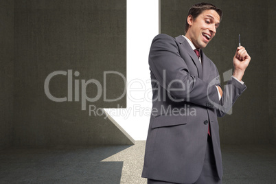 Composite image of thoughtful businessman holding pen