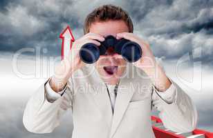 Composite image of positive businessman using binoculars