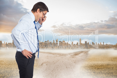 Composite image of thinking businessman tilting glasses