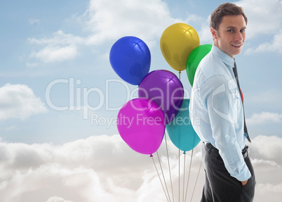 Composite image of happy businessman standing with hand in pocke