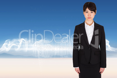 Composite image of serious businesswoman