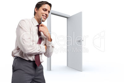 Composite image of thoughtful businessman holding pen to chin