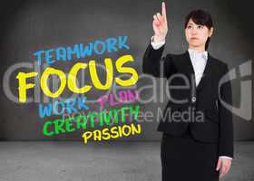 Composite image of focused businesswoman pointing