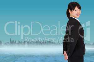 Composite image of smiling businesswoman