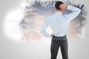 Composite image of thinking businessman scratching head