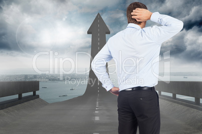 Composite image of thinking businessman scratching head