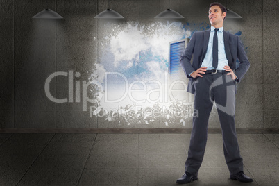 Composite image of happy businessman with hands on hips