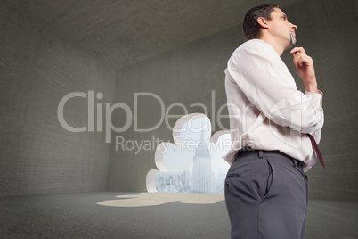 Composite image of thoughtful businessman holding pen to chin