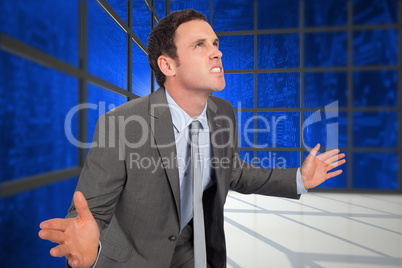 Composite image of businessman posing with hands out