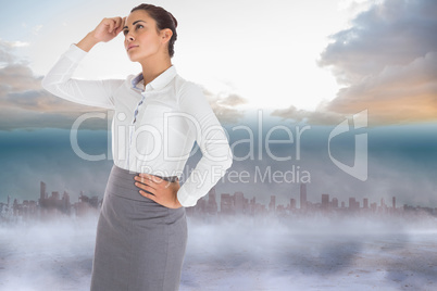 Composite image of focused businesswoman