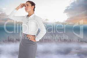 Composite image of focused businesswoman