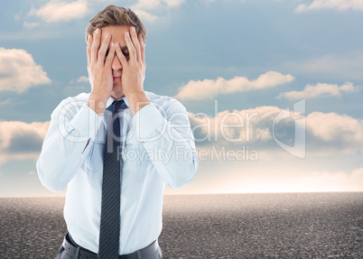 Composite image of businessman with a headache