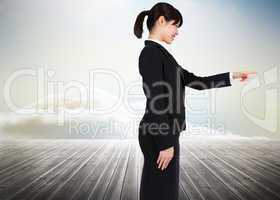 Composite image of smiling businesswoman pointing