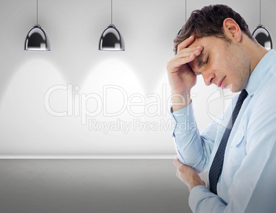 Composite image of businessman with a headache