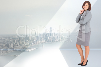 Composite image of smiling thoughtful businesswoman