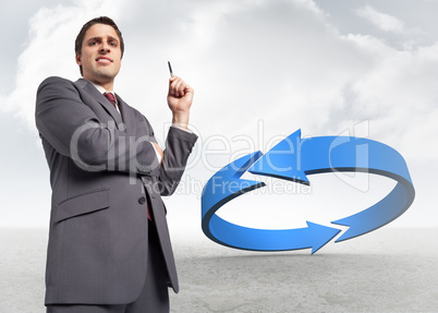 Composite image of thoughtful businessman holding pen