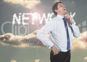 Composite image of thinking businessman touching his chin