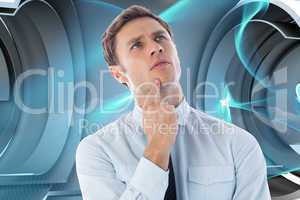 Composite image of thinking businessman with finger on chin