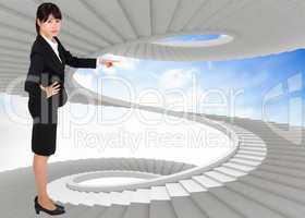 Composite image of businesswoman pointing