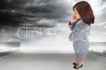 Composite image of focused businesswoman