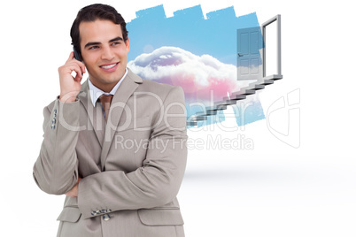 Composite image of smiling salesman on his cellphone