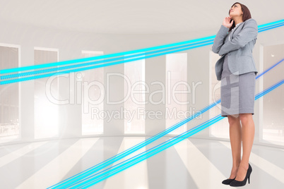 Composite image of focused businesswoman