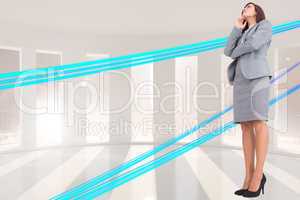 Composite image of focused businesswoman