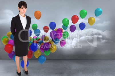 Composite image of businesswoman standing