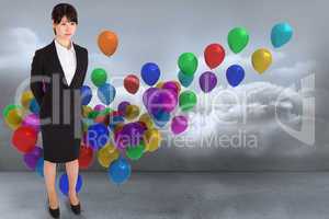 Composite image of businesswoman standing