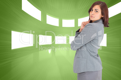 Composite image of concentrating businesswoman