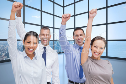 Composite image of cheerful work team posing with hands up