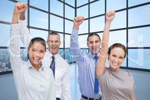 Composite image of cheerful work team posing with hands up