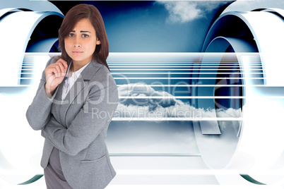 Composite image of worried businesswoman