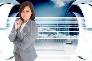 Composite image of worried businesswoman